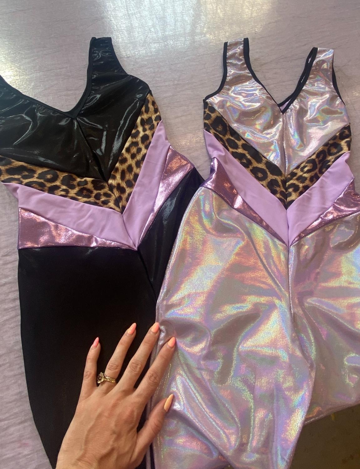 Burnt Soul custom peekaboo catsuits in black and lilac fabric 