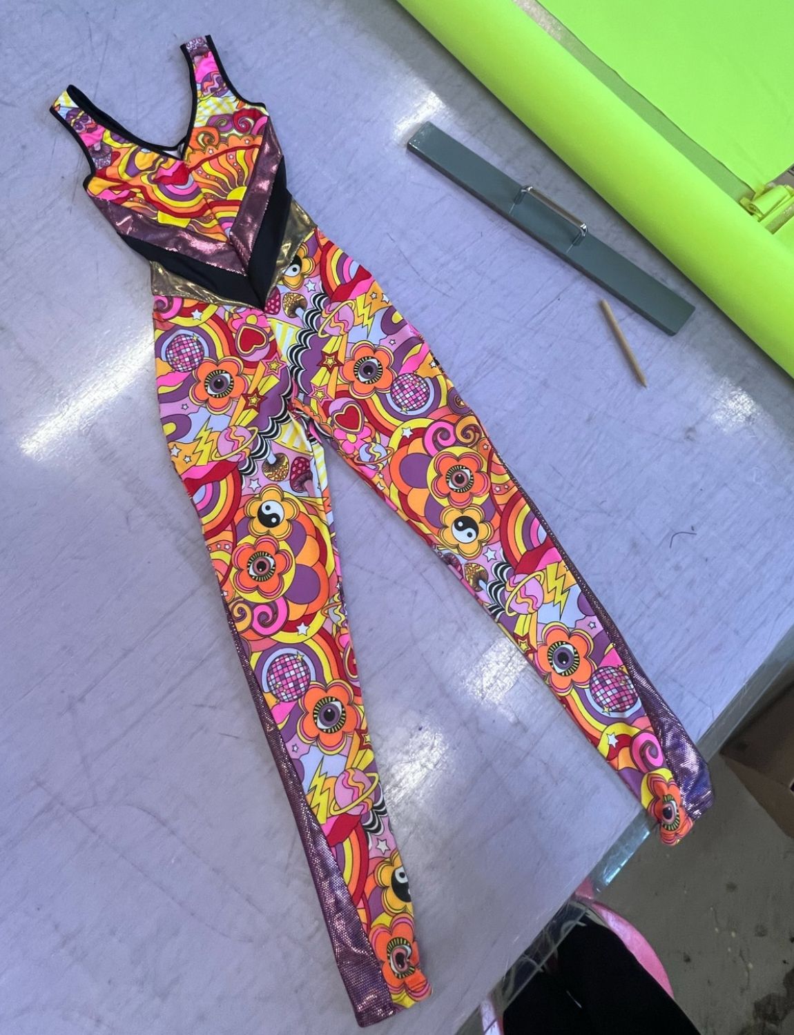 Burnt Soul custom peekaboo catsuit in dazzle fabric 