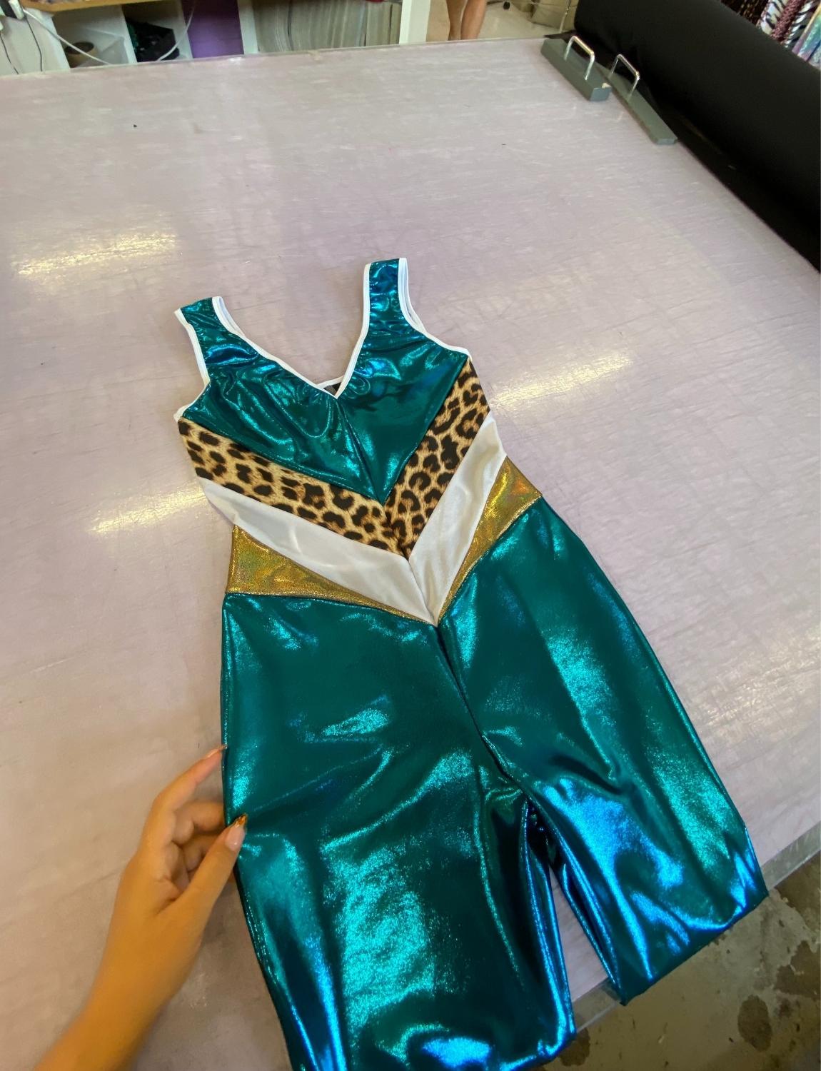 Burnt Soul custom peekaboo catsuit in electric blue fabric 