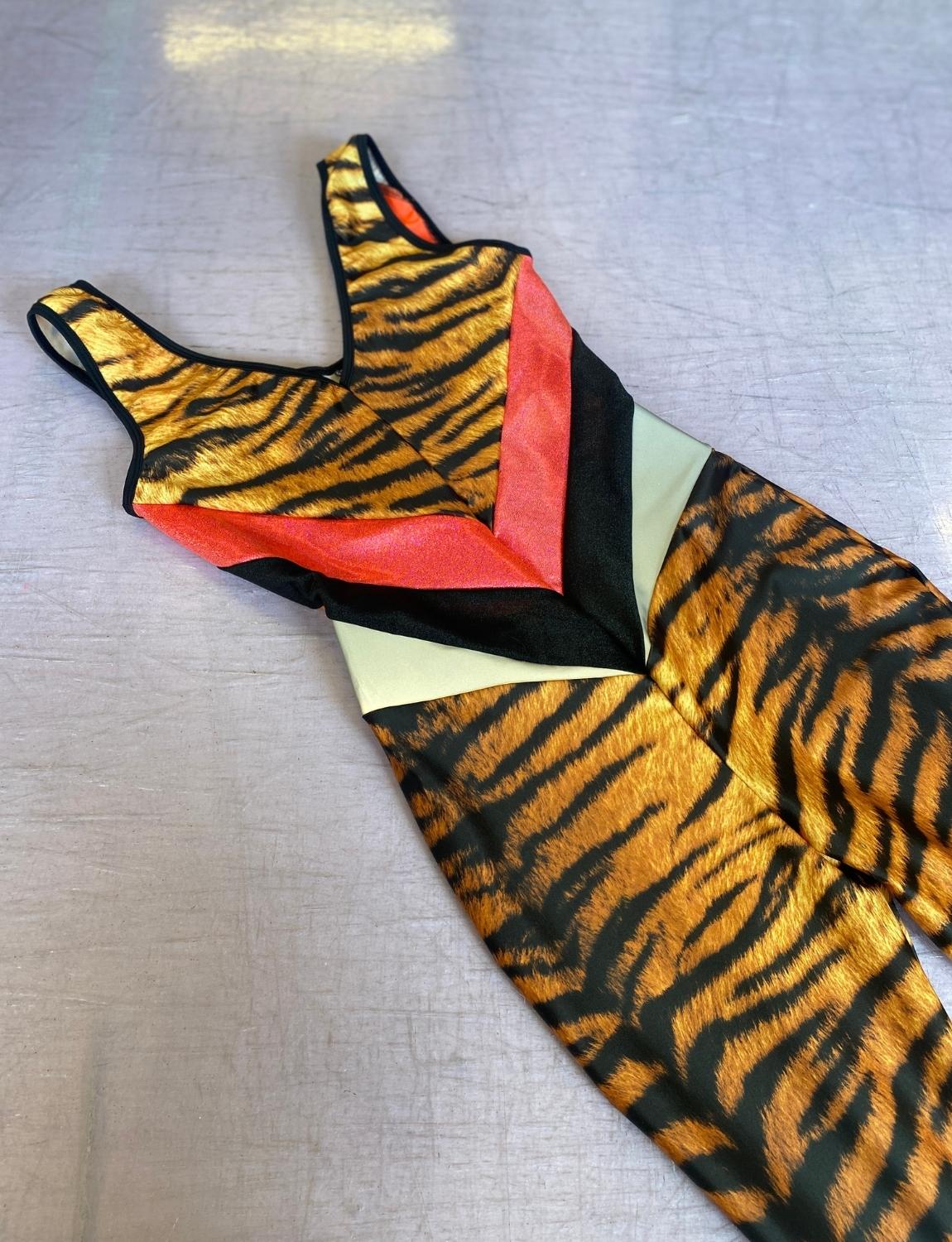 Burnt Soul custom peekaboo catsuit in tiger fabric 