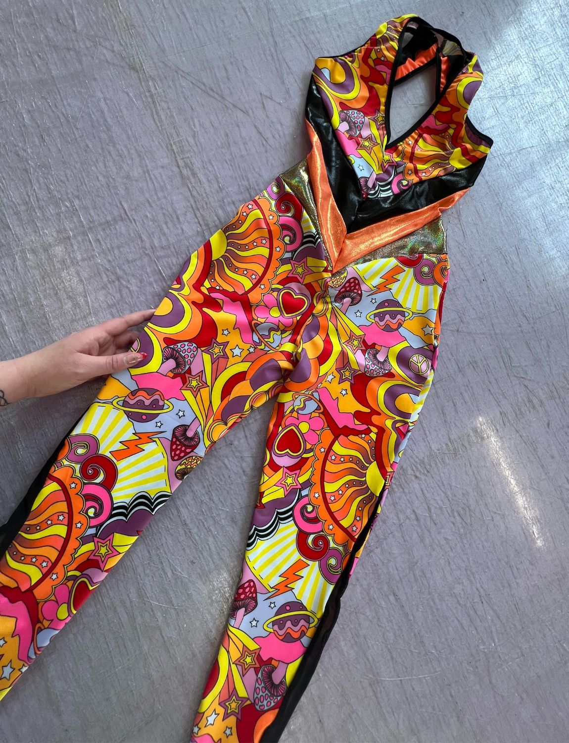 A custom Burnt Soul backless catsuit in bright colours 