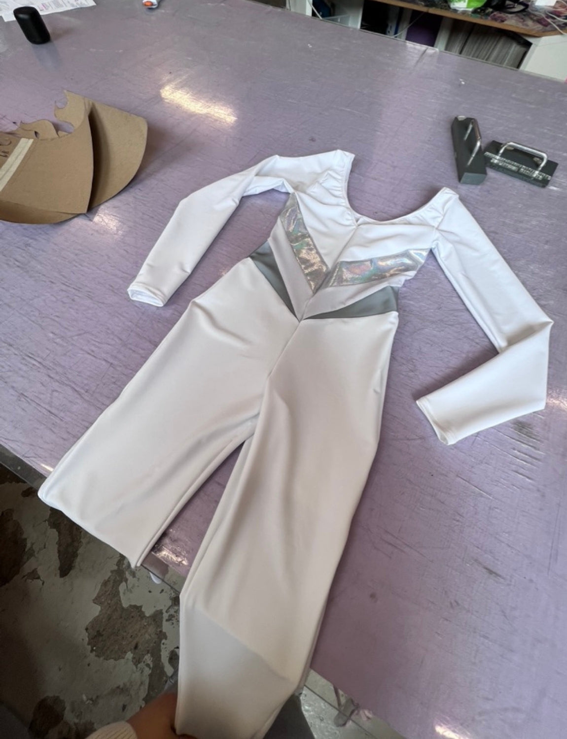 Burnt Soul custom peekaboo catsuit in white fabric with sleeves 